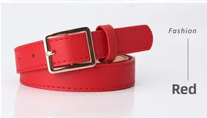 Detail view of slim red fashion belt with golden square buckle and fine stitching