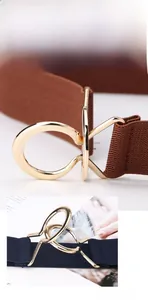 Detail of high-elasticity woven waist belt with interlocking gold metal buckle in navy and brown