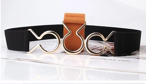 Detail of black and brown elastic waist belts with gold interlaced metal buckle design