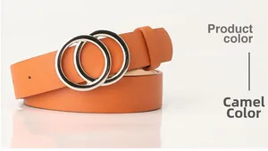 Close-up of camel leather belt with lychee texture and silver double ring buckle