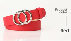 Close-up of red leather belt featuring double silver round rings and textured surface