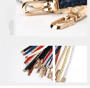 Detail of woven PU leather belts with gold buckles in various candy colors