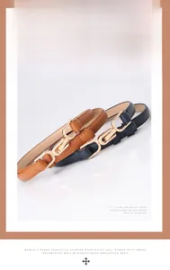 Detailed view of women thin belts in brown and navy leather with elegant gold buckles