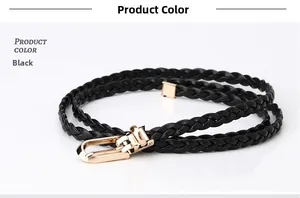 Close-up of a black woven thin belt with a polished gold-tone metal buckle detail