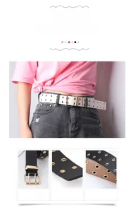Detail of double-grommet PU leather belts with twin-prong metal buckles in white and black