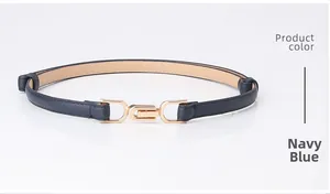 Detailed close-up of navy blue leather slim belt featuring a gold metal hook buckle
