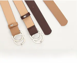 Detail of multi-color women belts with polished silver double ring metal buckles