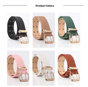 Detail showing various colors of double eyelet belts with golden double pin buckles