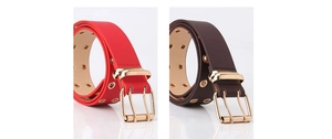 Detail of red and coffee leather belts featuring gold double-prong buckles and eyelets