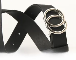 Close-up of black leather belt featuring a minimalist silver alloy double ring buckle