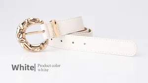 Detail of white leather belt showing golden hammered texture irregular metal buckle