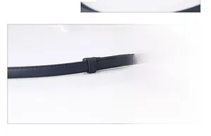 Detail of navy blue PU leather belt strap with refined stitching and matching belt loop