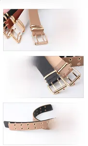 Detailed macro view of the double eyelet PU belt showing the golden iron buckle and holes