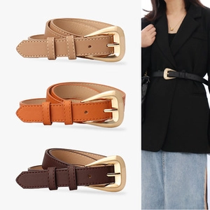 Détail de ceintures de taille élastiques avec boucles dorées en tons marron et caramel