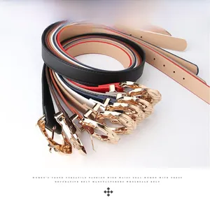 Detail of multi-color women's belts with interlocking gold hollow buckles and PU leather
