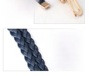 Detailed view of dark blue woven PU leather belt with a golden minimalist metal buckle