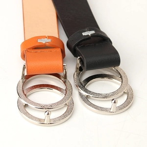 Women's trendy faux leather belt featuring a double circle silver metal buckle in black and orange