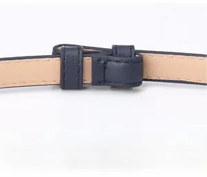 Detailed close-up showing the fine lychee grain texture and stitching of this navy leather belt