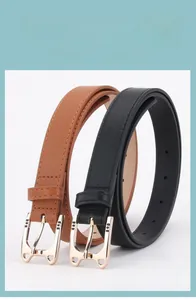Classic black and brown women's belts with elegant gold alloy buckles set on white background