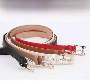 Detail view of cat-shaped gold alloy buckles on slim fashion belts in four classic colors