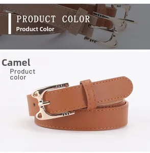 Macro shot of camel leather belt featuring a golden cat head alloy buckle with stitching