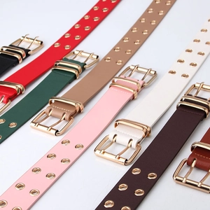 Women's double grommet fashion belts with gold double pin buckles in multiple colors