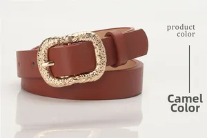 Detail of camel leather skinny belt with vintage embossed golden metal buckle