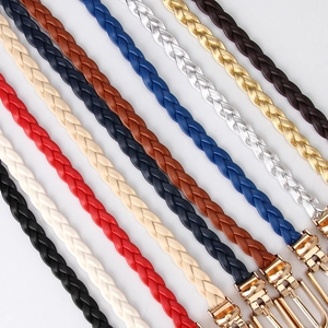 Elegant skinny woven belts for women with shiny gold buckles in multiple vibrant colors