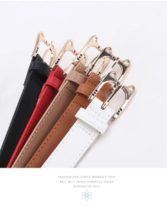 Detail of slim waist belts with golden cat-shaped alloy buckles in five vibrant colors