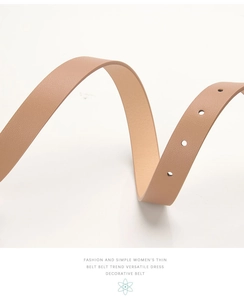Close-up of elegant light brown thin leather belt with lychee texture and adjustment holes