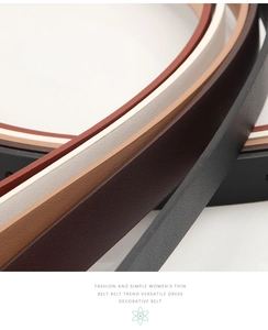 Close-up of assorted thin leather belts for women showing detailed litchi grain texture