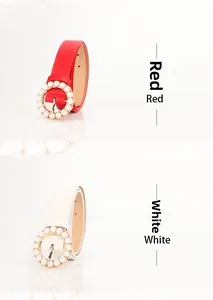 Detail view of red and white women's belts featuring elegant round pearl buckles