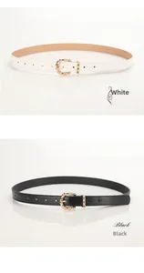 Close-up of elegant bamboo-textured gold buckles on slim white and black PU leather belts
