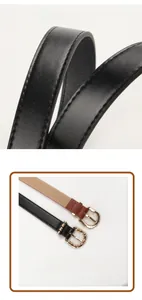 Macro detail of PU leather thin belt with gold bamboo texture buckle and stitching