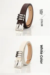 Close-up of coffee and white skinny belts with square metal buckles and leather texture