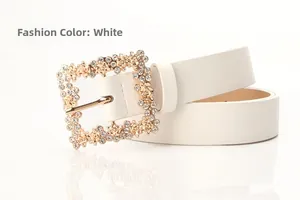 Detail of white PU leather belt featuring a gold hollow buckle with inlaid rhinestones