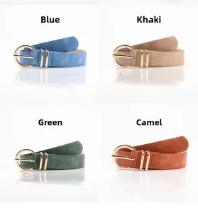 Detail view of simple women's belts in blue, khaki, green and camel with gold buckles