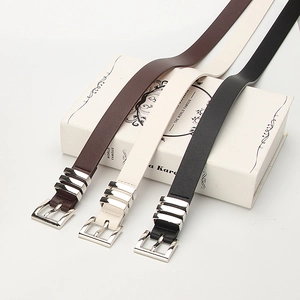 Set of three slim leather belts for women in coffee, white, and black with silver buckles