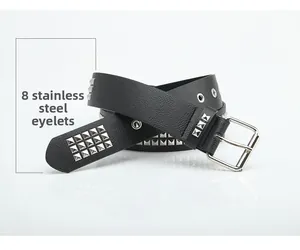Detail of black punk leather belt with silver pyramid studs and eight stainless steel eyelets