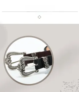 Detail of vintage carved alloy buckles on black and brown leather belts for women