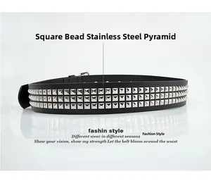 Detail view of black leather belt with three rows of silver stainless steel pyramid studs