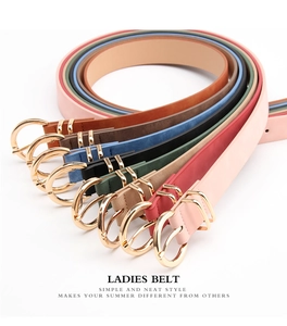 Detailed fan-style display of elegant women's thin leather belts with gold round buckles