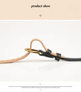Macro detail of the contrast leather belt with golden pin buckle and precise stitching