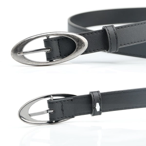 Classic black women belt with oval silver buckle and fine stitching on white background