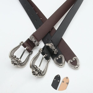 Vintage western leather belt set in black and brown with ornate silver crown buckles