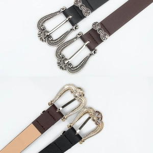 Vintage bohemian leather belts in black and brown with ornate engraved metal buckles