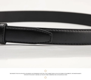 Close-up of black leather belt showing premium texture and fine stitching detail
