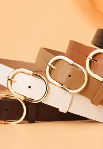 Detail showing various colors of women's PU belts with oval gold alloy buckles