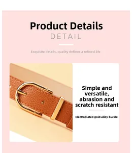 Detailed macro view of the brown lychee grain leather belt and gold alloy buckle