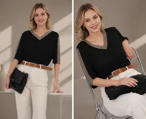 Close-up of minimalist brown PU leather belt with a golden oval buckle on white pants